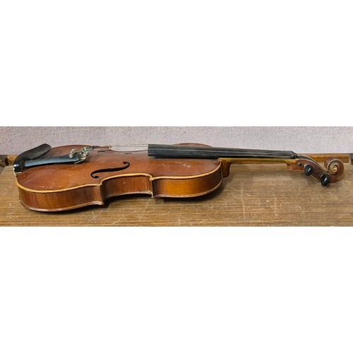 275 - A cased violin (length of back inc. button 35cm) and bow