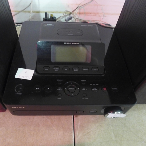 5141 - A Sony Giga Juke HDD audio system with 2 speakers with digital media dock