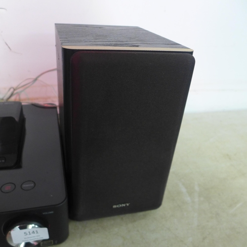 5141 - A Sony Giga Juke HDD audio system with 2 speakers with digital media dock