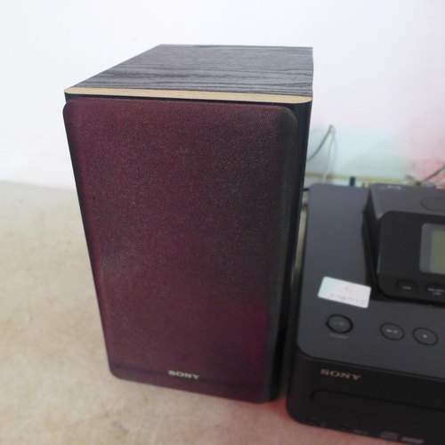 5141 - A Sony Giga Juke HDD audio system with 2 speakers with digital media dock