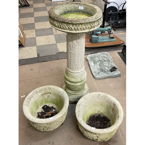 253 - A pair of concrete garden planters and a bird bath