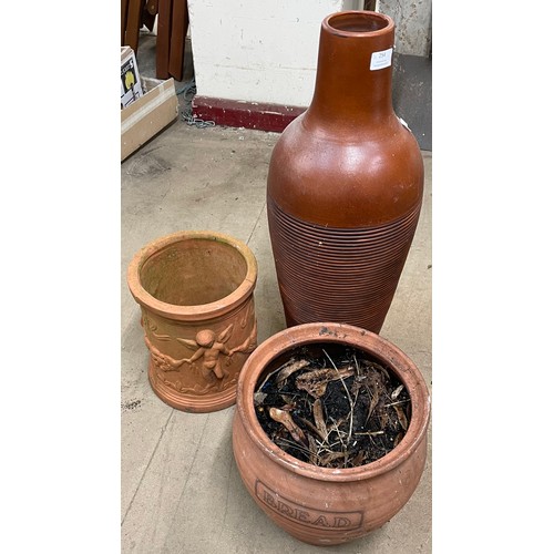 254 - A salt glazed terracotta vase and two terracotta planters