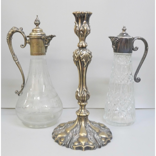 2006 - Two claret jugs, one with etched glass and inner stopper, and a candlestick with leaf detail, candle... 