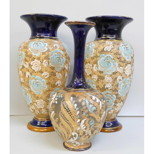 2011 - A pair of Doulton Lambeth vases, 27.5cm, and one other