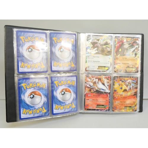 2023 - A folder of vintage Pokémon holographic cards including Ex Mega cards, etc., and holographic 2000 Te... 