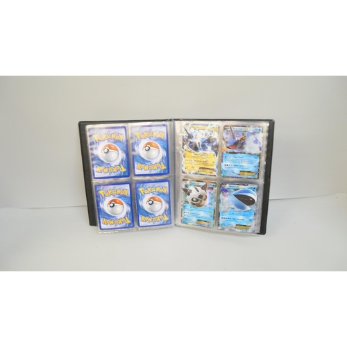 2023 - A folder of vintage Pokémon holographic cards including Ex Mega cards, etc., and holographic 2000 Te... 