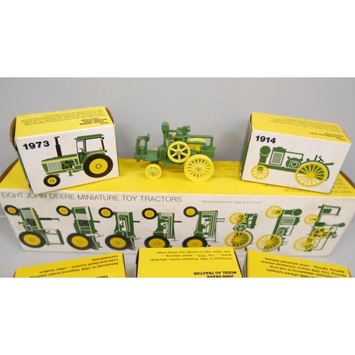 2036 - An Ertl International Harvester Historical Toy Tractor set and eight John Deere miniature toy tracto... 