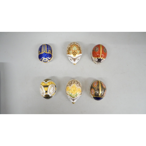 2046 - A collection of six Royal Crown Derby hedgehog paperweights with gold stoppers