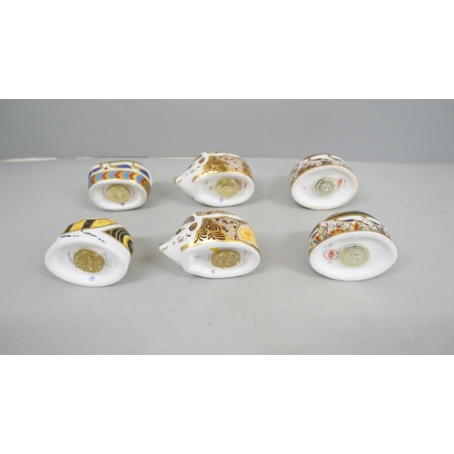 2046 - A collection of six Royal Crown Derby hedgehog paperweights with gold stoppers