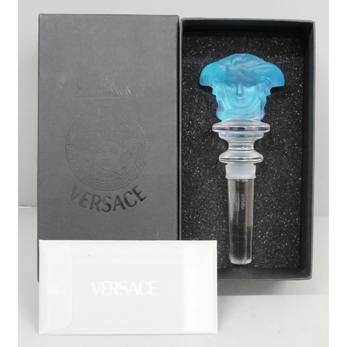 2050 - A Versace light blue glass bottle stopper, boxed