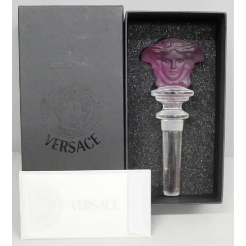 2051 - A Versace red glass bottle stopper, boxed