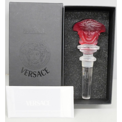 2052 - A Versace red glass bottle stopper, boxed