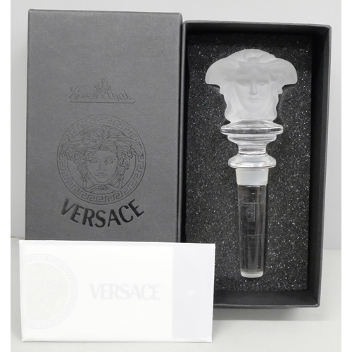 2056 - A Versace clear glass bottle stopper, boxed