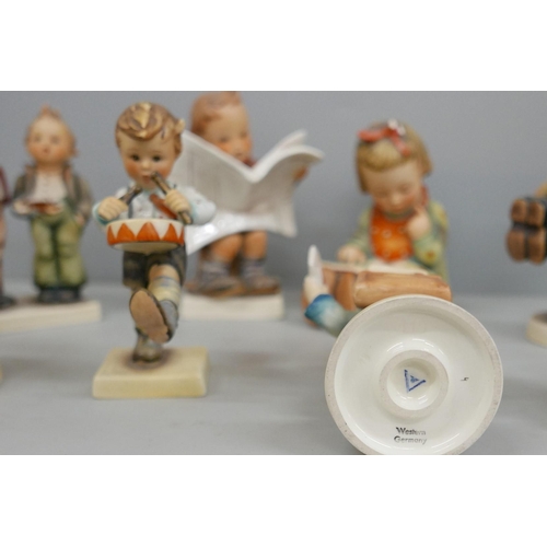 2064 - Eight Hummel figures including Boy Reading Newspaper and Little Goat Herder (a/f)