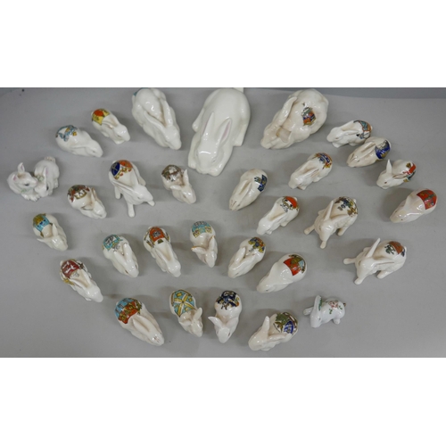 2113 - A collection of china rabbits including Belleek, crested china, Longton china, etc., approximately 3... 