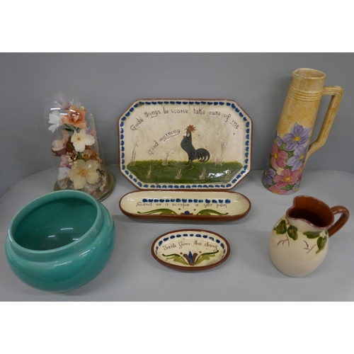 2115 - A collection of pottery including Watcombe, Torquay and a glass dome with flowers