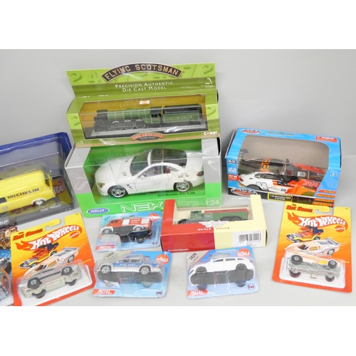 2136 - A collection of die-cast vehicles including a Corgi Flying Scotsman, Nex car, Michelin van, Jurassic... 