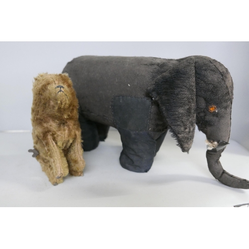 2185 - An Isa Animated Toys plush black elephant with sprung legs, trunk a/f and a clockwork bear, both 192... 