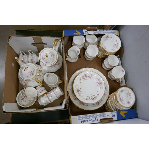 2192 - A Paragon Victorian Rose dinner service, eight dinner, six side and ten tea plates, eight pudding bo... 