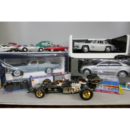 2193 - A collection of die-cast cars including a John Player Special racing car, Mercedes, VW Beetle, Match... 