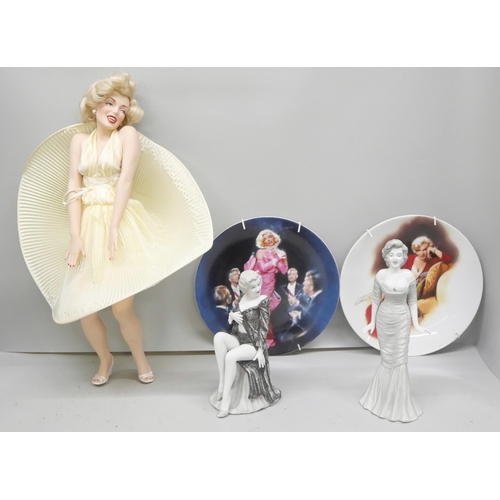 2308 - A collection of Marilyn Monroe items including a set of 14 collectors plates, a sheet of stamps, two... 