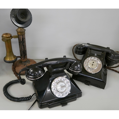 2314 - Three telephones comprising an early 20th Century candlestick phone, a 1940s Bakelite phone and a mo... 