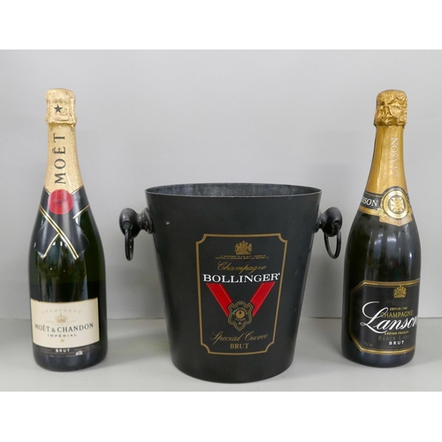 2319 - Two bottles of Champagne, Moët & Chandon and Lanson, and a Bollinger ice bucket **PLEASE NOTE THIS L... 