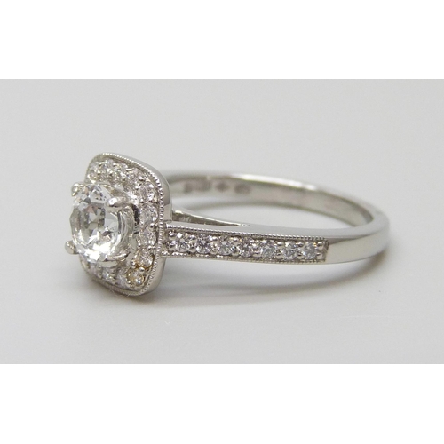 7006 - A platinum ring with a Swarovski natural white topaz, surrounded with brilliant cut diamonds and dia... 