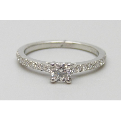 7009 - A platinum and diamond ring with diamond shoulders, total diamond weight 0.41ct, 2.9g, L