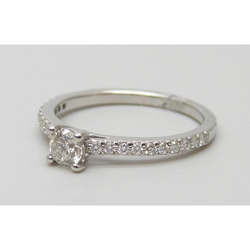 7009 - A platinum and diamond ring with diamond shoulders, total diamond weight 0.41ct, 2.9g, L