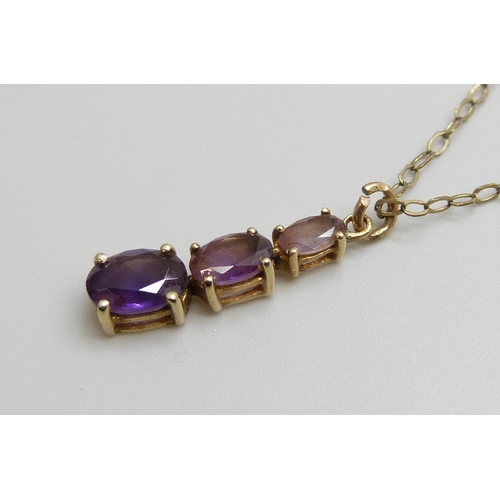 7010 - A 9ct and amethyst pendant on a 9ct gold chain, 1.7g