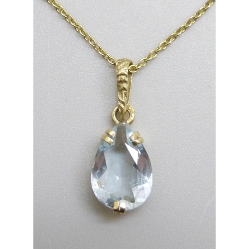 7011 - A 14ct gold and aquamarine pendant and chain, 1.4g