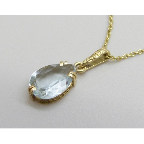 7011 - A 14ct gold and aquamarine pendant and chain, 1.4g