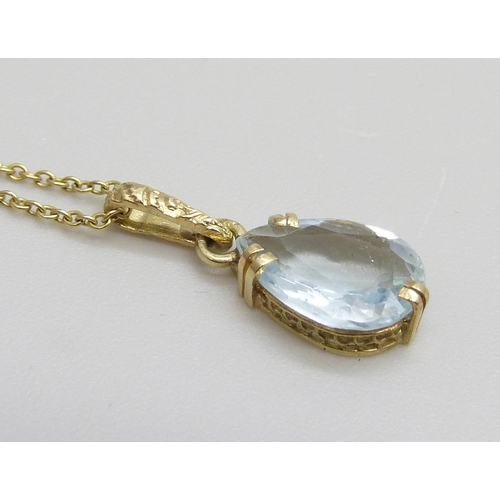 7011 - A 14ct gold and aquamarine pendant and chain, 1.4g