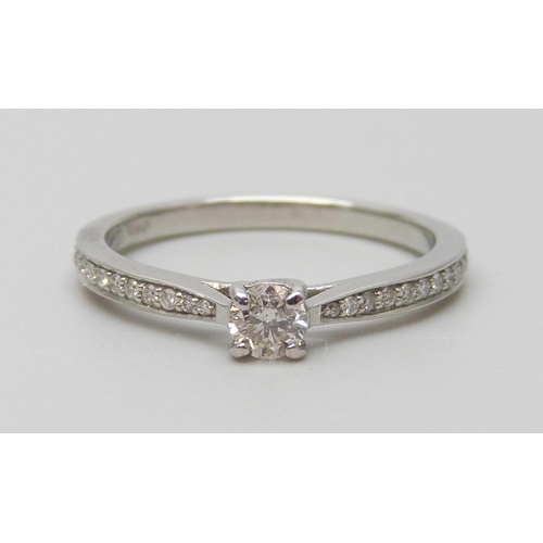 7012 - A platinum and diamond ring with diamond shoulders, total diamond weight 0.30ct, 3g, L