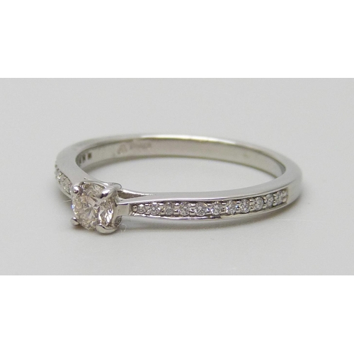 7012 - A platinum and diamond ring with diamond shoulders, total diamond weight 0.30ct, 3g, L