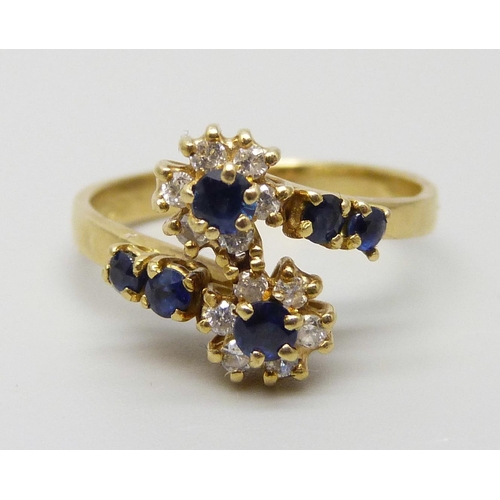 7015 - An 18ct gold, diamond and sapphire ring, 3.4g, K