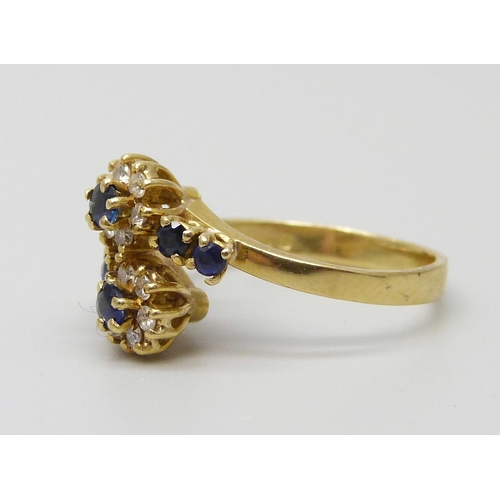 7015 - An 18ct gold, diamond and sapphire ring, 3.4g, K