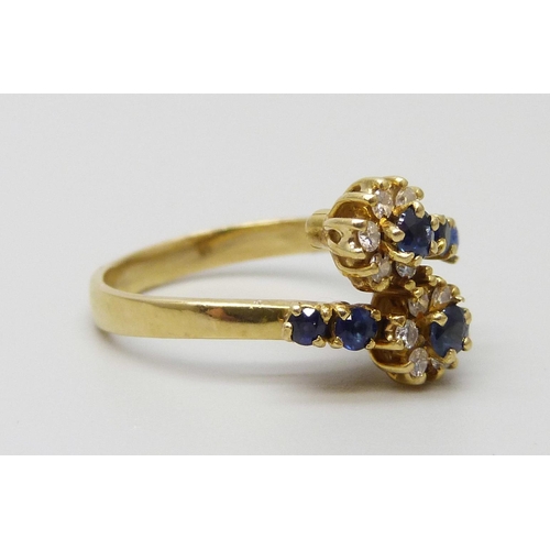 7015 - An 18ct gold, diamond and sapphire ring, 3.4g, K