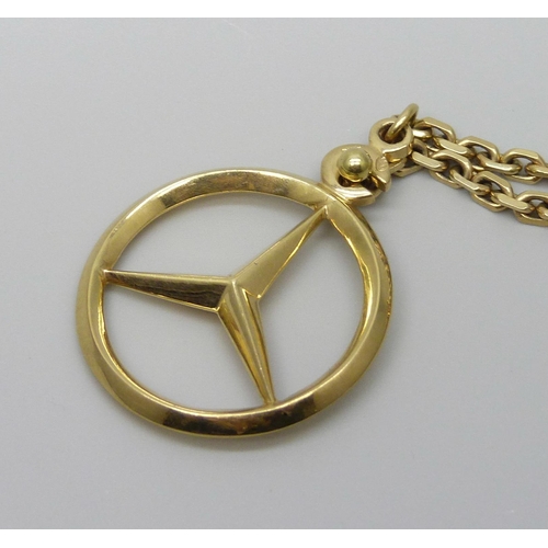 7018 - A yellow metal toothpick/ear scoop with Chinese marks on a 14ct gold chain with Mercedes Benz pendan... 