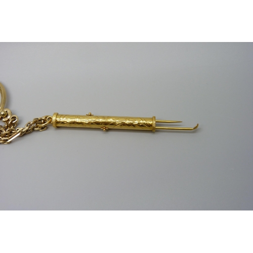 7018 - A yellow metal toothpick/ear scoop with Chinese marks on a 14ct gold chain with Mercedes Benz pendan... 