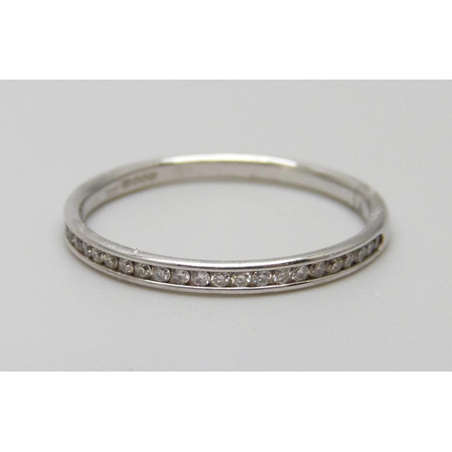 7026 - A 9ct white gold band set with diamonds, 1g, L½