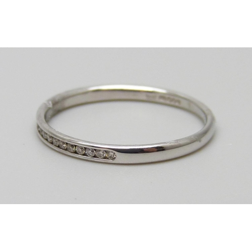 7026 - A 9ct white gold band set with diamonds, 1g, L½