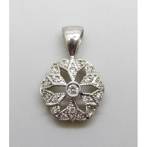 7038 - A 9ct white gold and diamond pendant, 1.3g