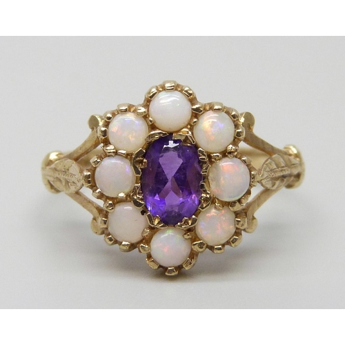 7039 - A 9ct gold, opal and amethyst ring, 2.3g, N