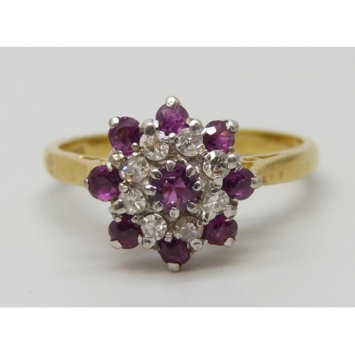 7041 - An 18ct gold, diamond and ruby ring, 3.8g, O