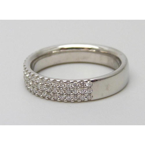 7043 - A platinum three row multi diamond set ring, 5.1g, I