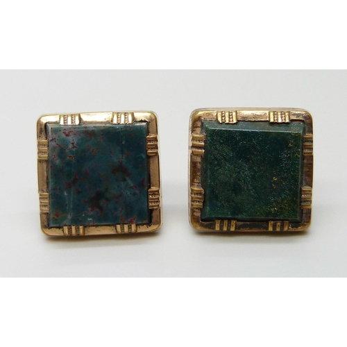 7048 - A pair of mother of pearl set cufflinks and two green stone set cufflinks/buttons