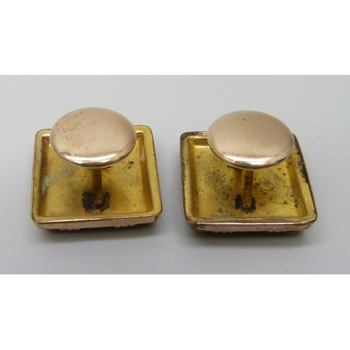 7048 - A pair of mother of pearl set cufflinks and two green stone set cufflinks/buttons