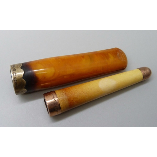 7053 - A 9ct gold mounted cigarette holder, London 1901 and a similar butterscotch amber example with silve... 